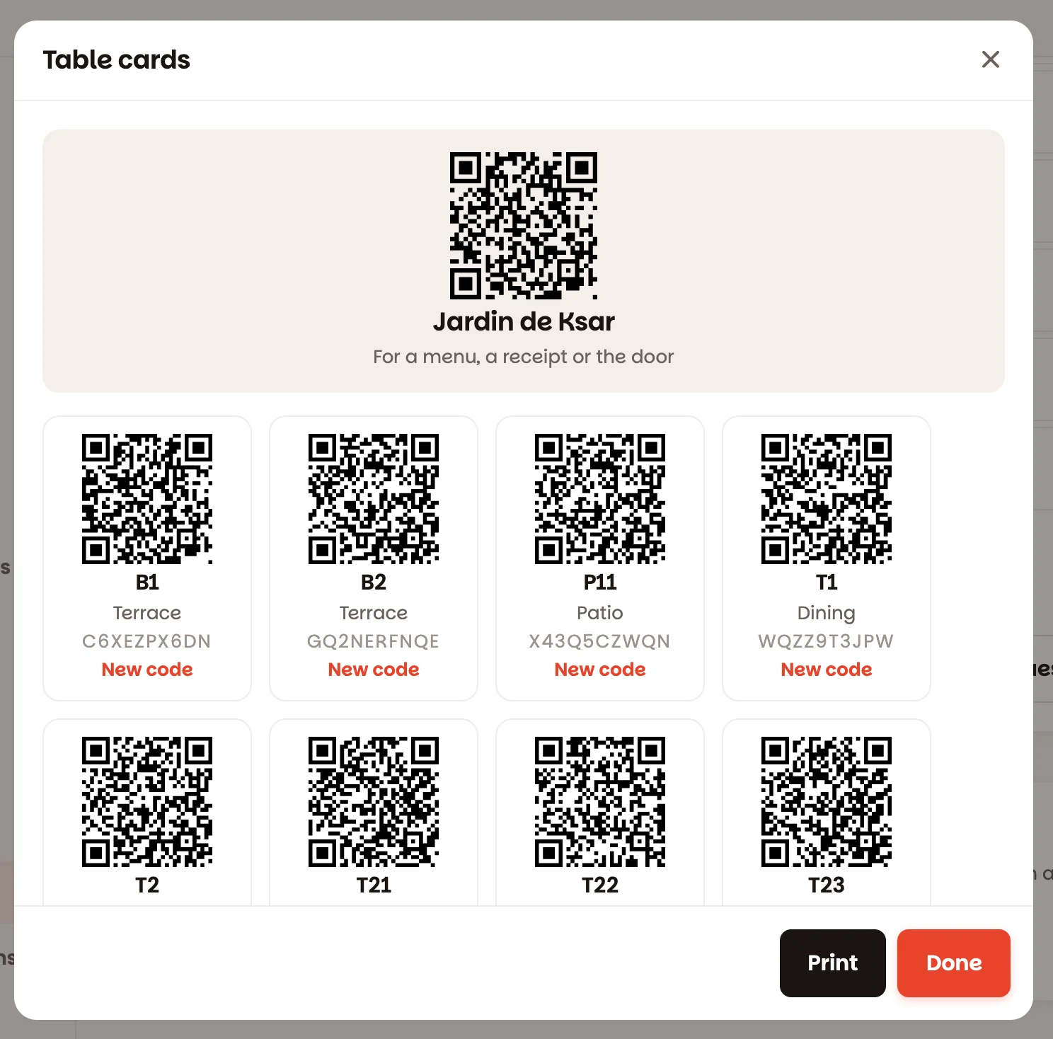 The table cards, one QR code per table